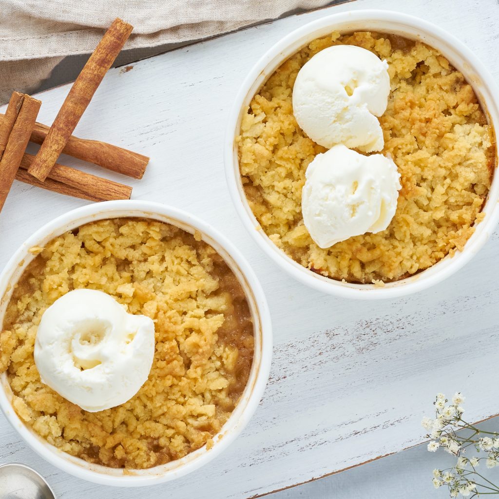 Apple crumble with the ice cream, streusel. Top view, close up