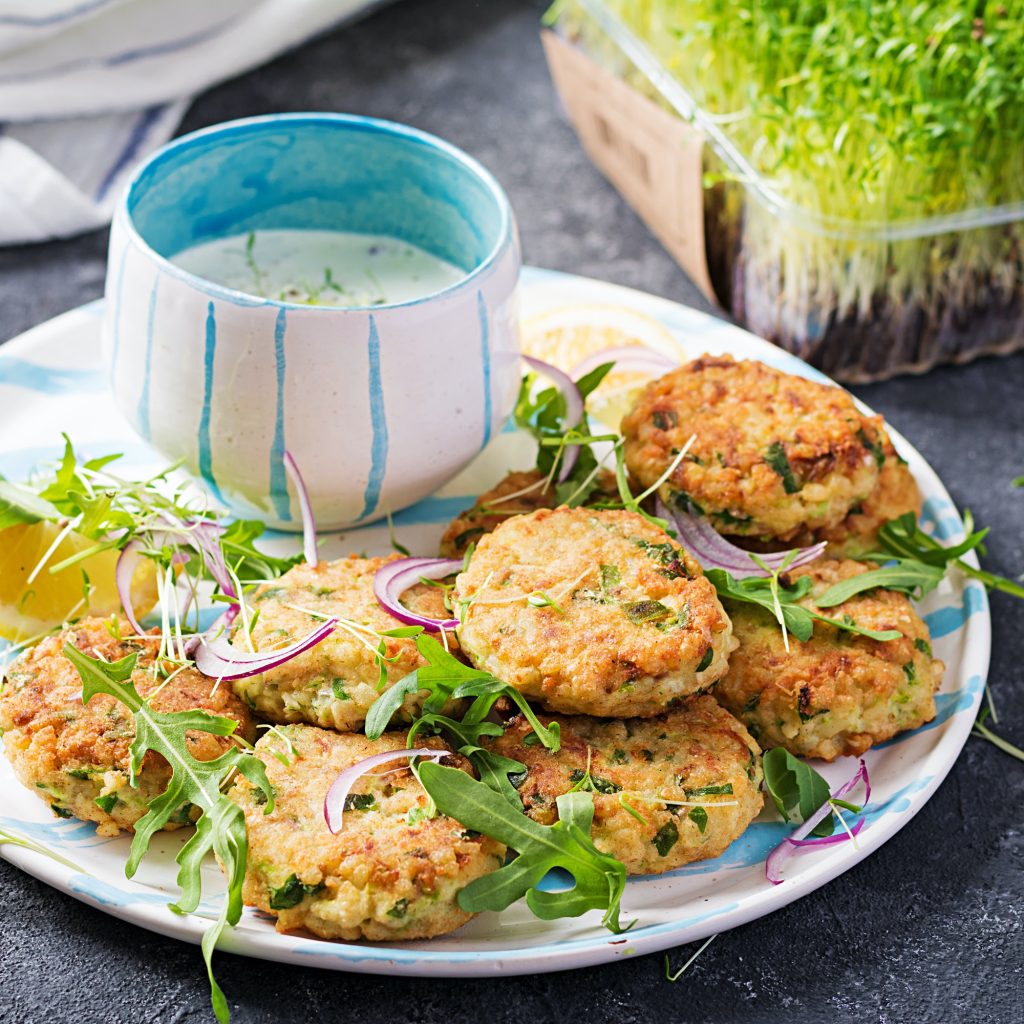 Homemade fish croquette with white fish, bulgur, spinach and breadcrumbs. Fritters from minced cod.