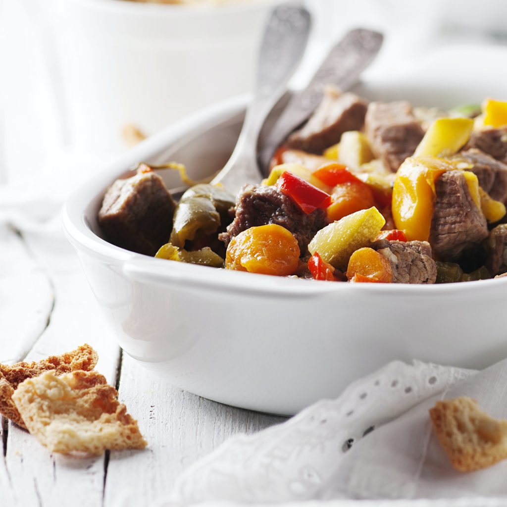 Stewed meat with carrot, paprika and rosemary